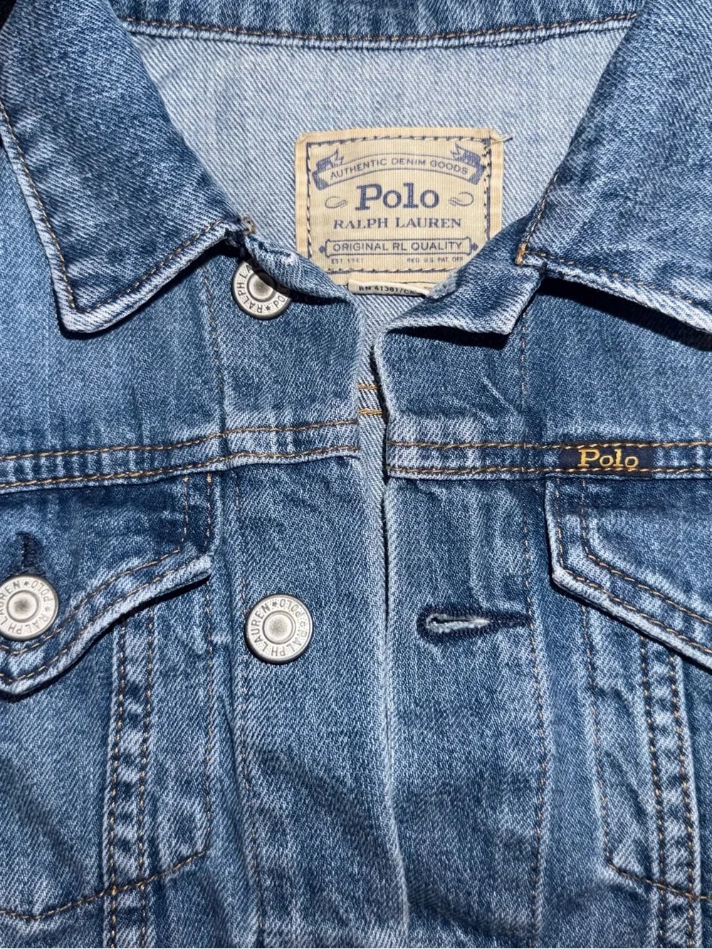 Ralph Lauren Polo Light Blue Denim distressed Jacket. Polo print on the back.